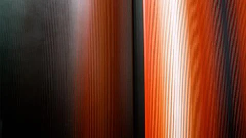 Abstract vertical lines with glowing orange and black gradient 写真素材