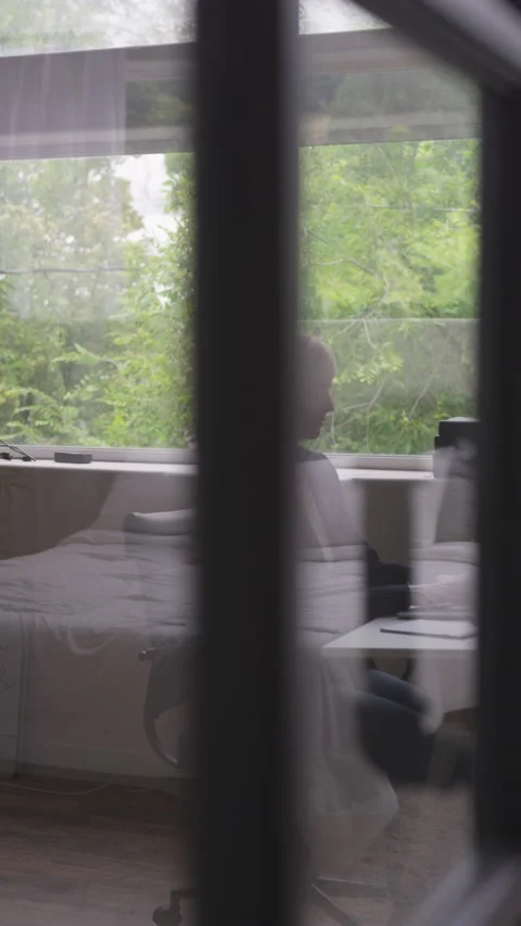 Abstract Vertical of Pretty Blonde with Pixie Haircut Typing on Her Computer Video stock 208778173