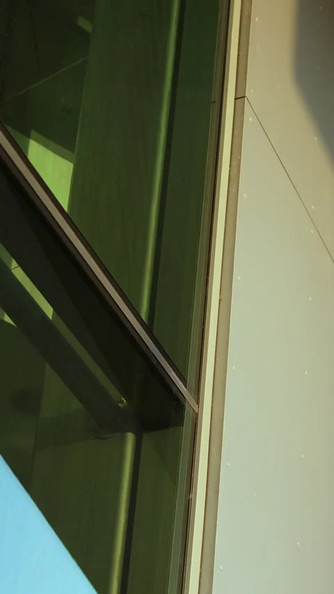 Abstract Vertical Shot of Modern Glass Building Facade and Steel Architecture Stock Footage 331575151