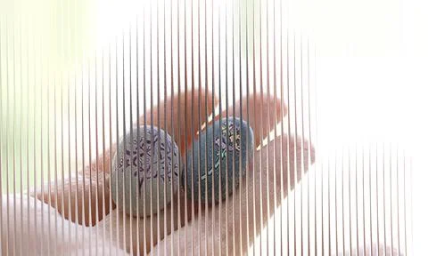 Abstract Vertical Sliced Painted Pebbles in Hand Background Stock Photos