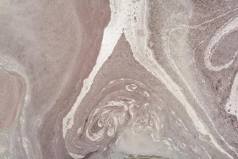 Abstract, vibrant, and dynamic pattern created by the flow and mixture of v.. Stock Photos