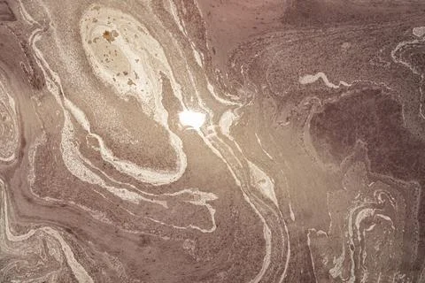 Abstract, vibrant, and dynamic pattern created by the flow and mixture of var Stock Photos