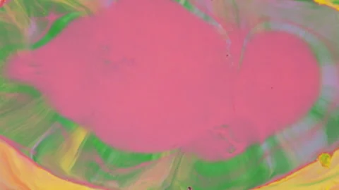 Abstract vibrant fluid motion with pink yellow and green paint swirls Stock Footage 331664596