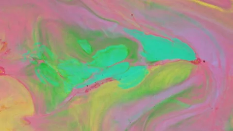Abstract vibrant fluid motion with pink yellow and green paint swirls Stock Footage 331665364