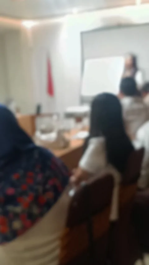 A abstract video of group of people in a classroom or meeting room, attentively Stock Footage 340533727