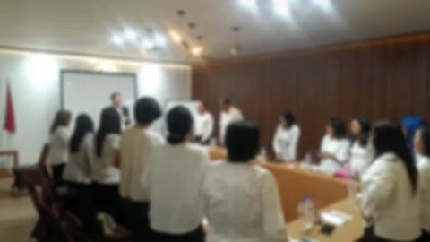 A abstract video of group people, mostly wearing white shirts, are gathered in a Stock Footage 340533792