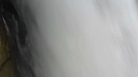 Abstract video of water falling down a large waterfall Stock Footage 152862193