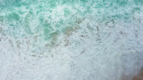 Abstract view from above of waves breaking along a beach Stock Footage 142245261