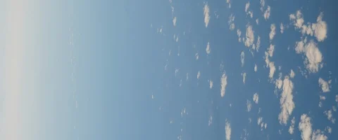 Abstract view of blue sky and clouds from an airplane. BMPCC 4K Stock Footage 127136327