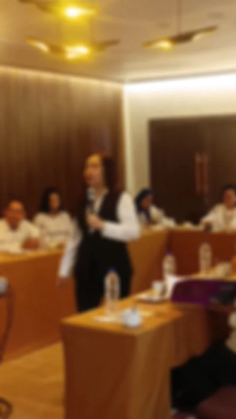 A abstract view of A business meeting in progress, with a female presenter Stock Footage 340533719