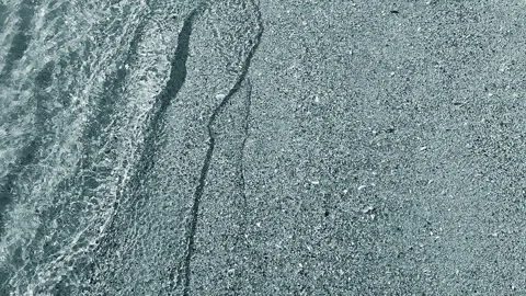 Abstract view of clean transparent water small sea wave rolling sand sandy beach Stock-Footage 294637525