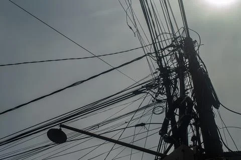 Abstract view of a complex network of crisscrossing electrical wires and ca.. Stock Photos