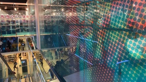 Abstract view of escalator reflection with people in department store Stock-Footage 117792481