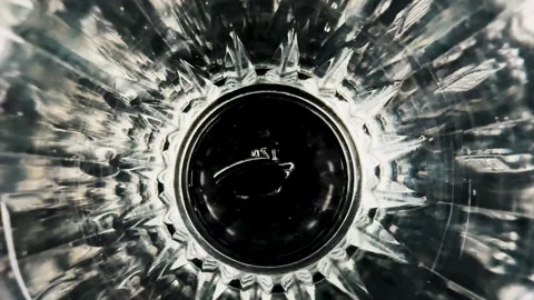 Abstract view looking down into a faceted glass container Stock Footage 340580976
