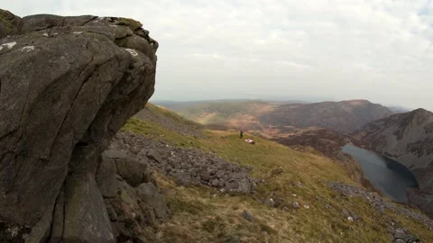 Abstract view of a man setting up a tent in the mountains Video stock 208021654