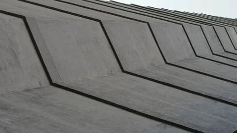 Abstract view of modern concrete structure with repeating geometric lines and Stock Photos