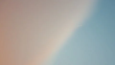 Abstract view of pastel sky with soft cloud and airplane trail Video stock 328332818