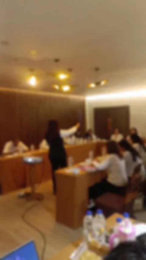A abstract view of A presenter leads a business meeting, engaging an attentive Stock Footage 340533839