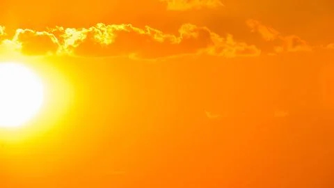 Abstract view of the sun shining brightly in an intensely orange atmosphere. Stock Photos
