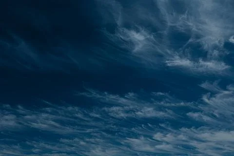 An abstract view of thin, faint clouds drifting across. Stock Photos