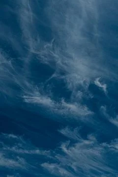 An abstract view of thin, faint clouds drifting across. Stock Photos