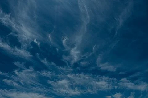 An abstract view of thin, faint clouds drifting across. Stock Photos