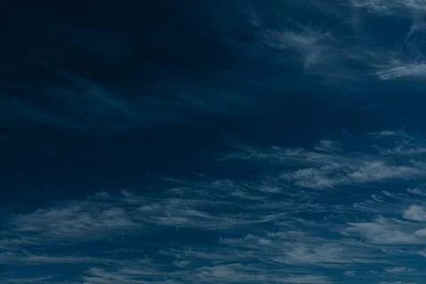 An abstract view of thin, faint clouds drifting across. Stock Photos