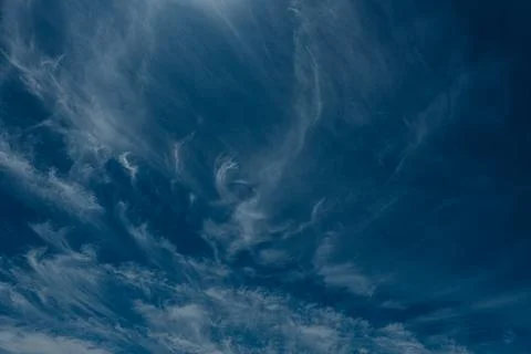 An abstract view of thin, faint clouds drifting across. Stock Photos