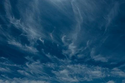 An abstract view of thin, faint clouds drifting across. 写真素材