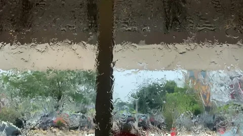 Abstract View Through Rain-Drenched Glass Stock Footage 287995264
