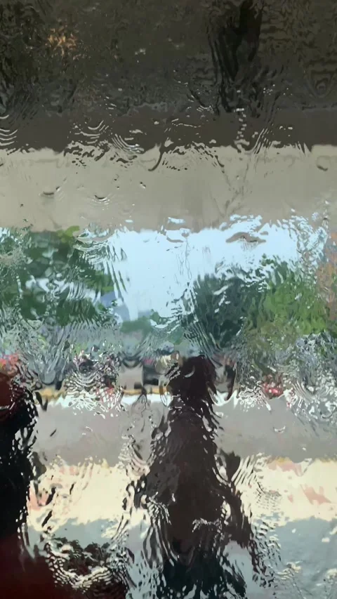 Abstract View Through Rain-Drenched Glass Video stock 287995385