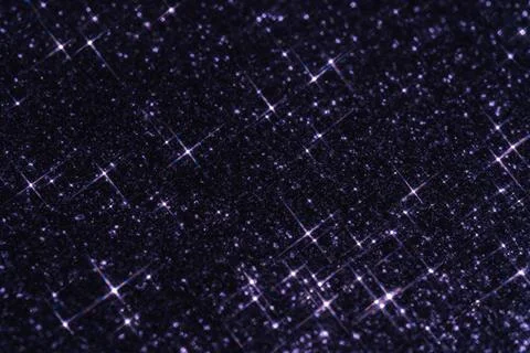 Abstract violet background with sparkles in the shape of stars. Stock Photos