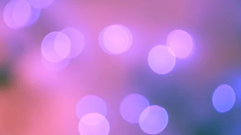 Abstract violet bokeh lights on defocused warm pink background Stock-Footage 100229651