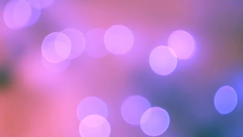 Abstract violet bokeh lights on defocused warm pink background Vídeos de archivo 100229652