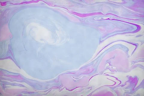 Abstract violet marble background. Stains of paint on the water. Stock Photos