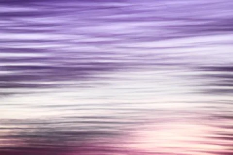 Abstract violet wavy cloudy sunset sky background Stock Photos