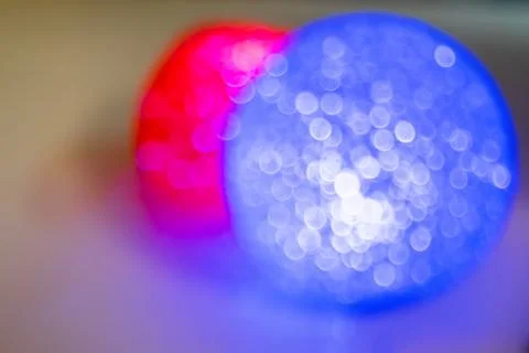 Abstract vision of defocused two blurring circles red and blue. Stock Photos