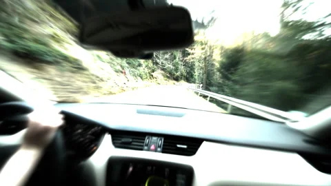Abstract vision from inside the car of person driving on a tiny rural highway 動画素材 147104649
