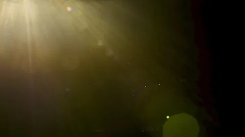Abstract volume light beams and sun rays lens flare on black background Stock Footage 345960828