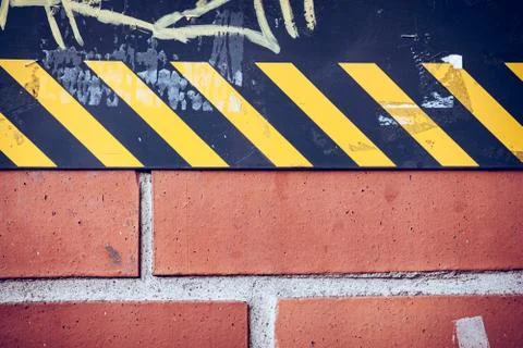 Abstract of wall in city street with caution stripes Foto stock