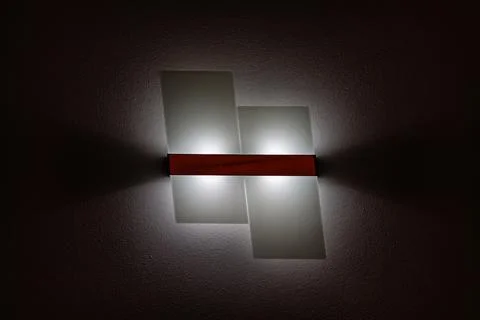 Abstract wall light on dark textured wall Stock Photos