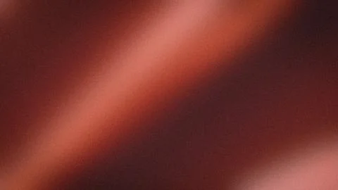 Abstract warm gradient background in red brown and dark orange hues 4K with.. Stock Photos