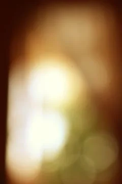 Abstract warm light bokeh background with golden brown tones effect Stock Photos