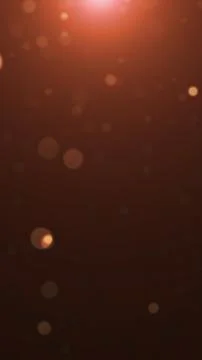 Abstract warm orange bokeh background with soft glowing circles floating on.. 스톡 일러스트