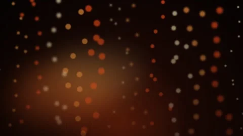 Abstract warm orange bokeh particles floating on dark background Stock Footage 335863117