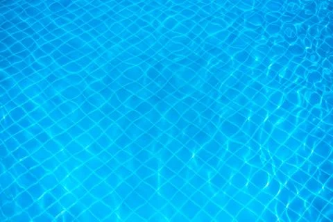 Abstract water background. Pattern in swimming pool background. Stock Photos