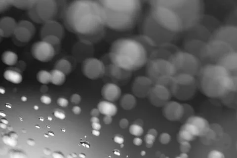 Abstract water drops on plain background, black and white photography Stock Photos