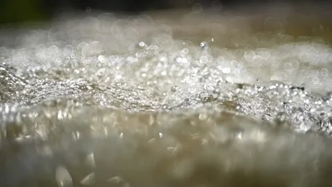 Abstract water figures in summer sunlight in the mountains (slow motion, bokeh) Stock-Footage 219640552