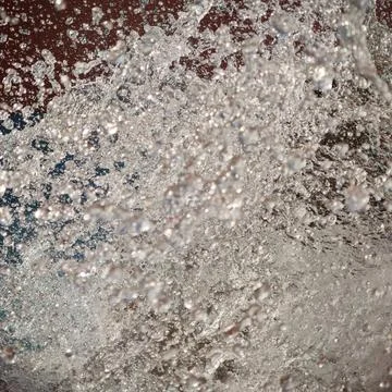 Abstract water splash texture background with frozen motion droplets. Stock Photos