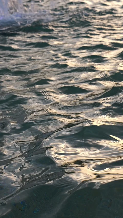 Abstract water surface background: vertical mobile video of water waves dur.. Stock Footage 313833638